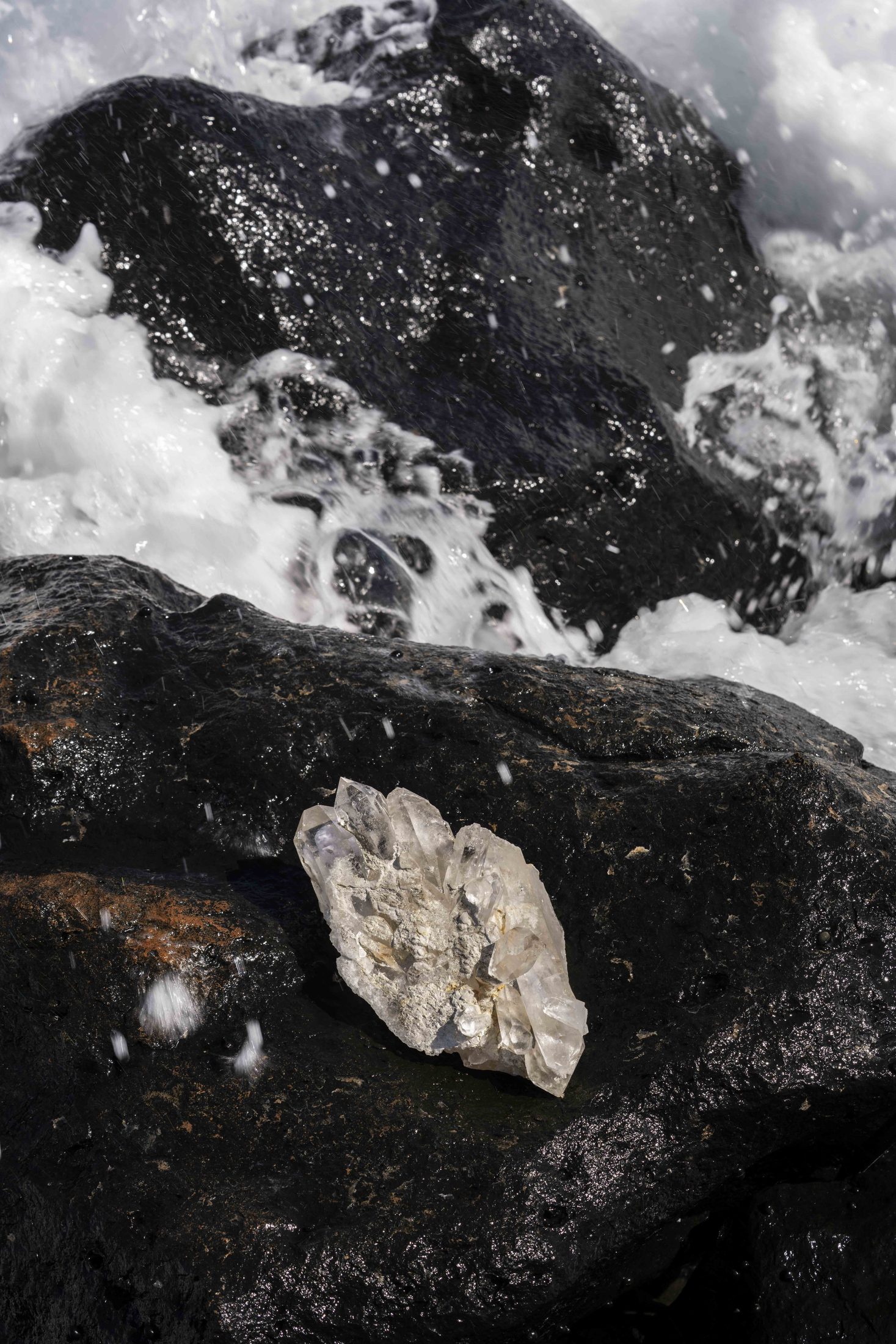 Quartz specimen on volcanic basalt in the surf