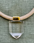 Close up view of clear quartz pendant from Dorow Collection