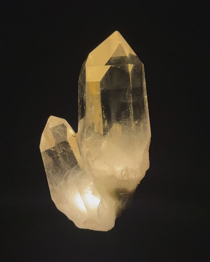 This naturally shaped and colored citrine displays a rare and fascinating twin formation. Polished to perfection and mounted on a lighted custom copper base it uses a 12V adapter plug.