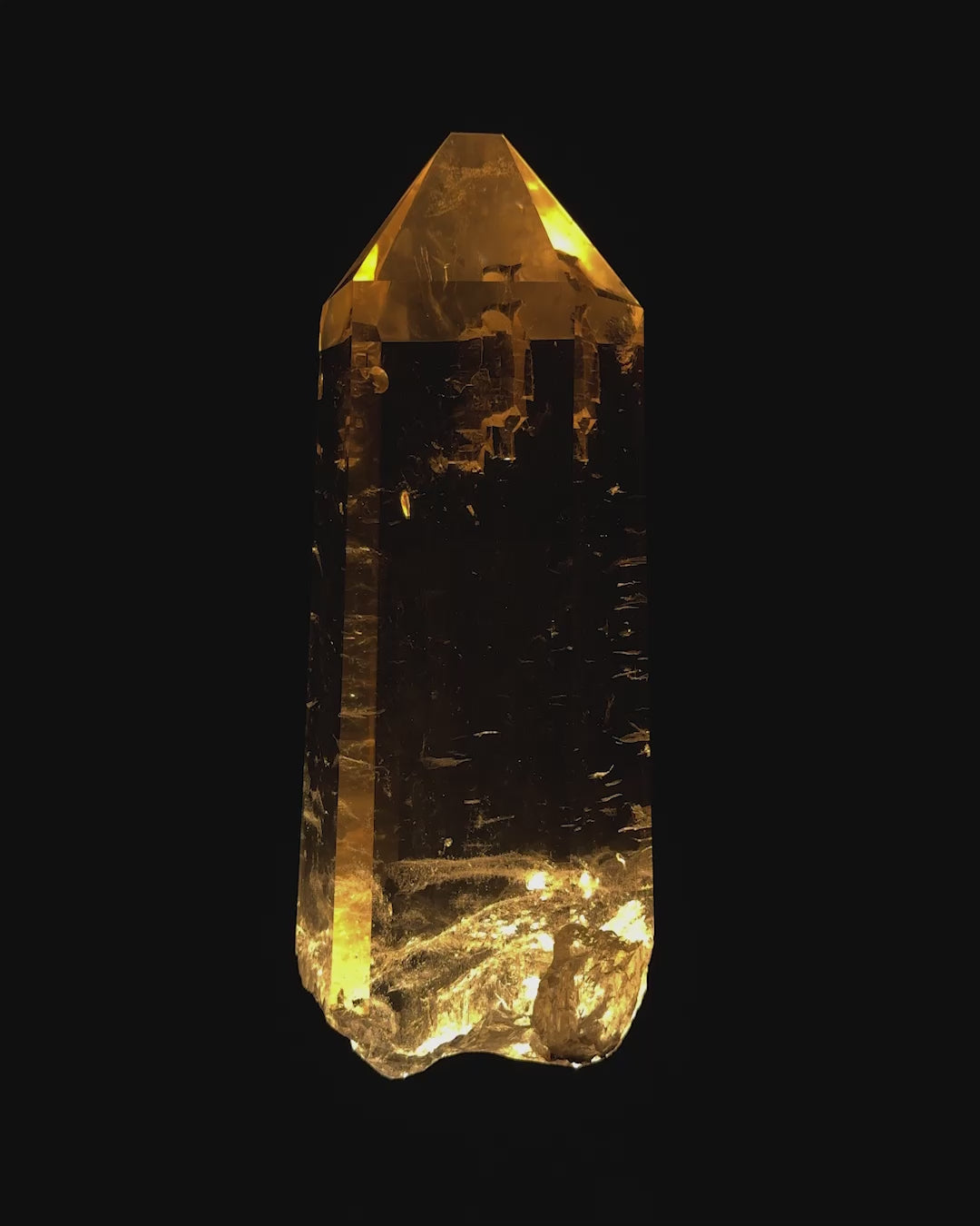  Naturally formed and colored partially polished citrine displays a chisel tip and an etched detail on its back surface. 